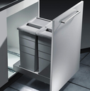 Sliding trash bin with soft-close mechanism